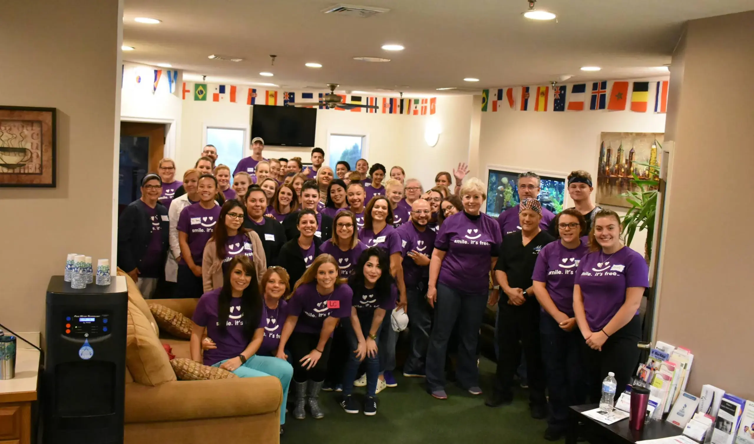 The Massanutten Dental Team staff posing together in matching purple shirts
